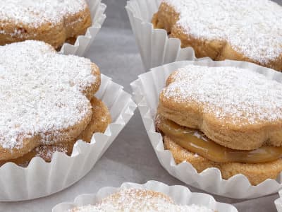 Close-up of an alfajor with the dulce de leche filling visible